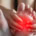 A person suffering from small fiber neuropathy grabs their foot to relieve the pain.